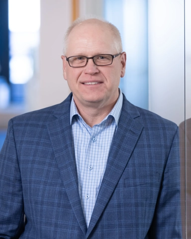 portrait of a smiling person in professional attire